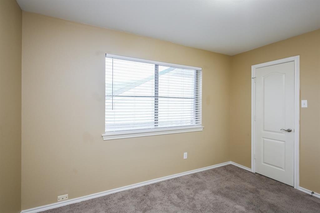 148 Cliff Height Circle Dallas, TX 75241 - Photo 4 of 17 an empty room with a window