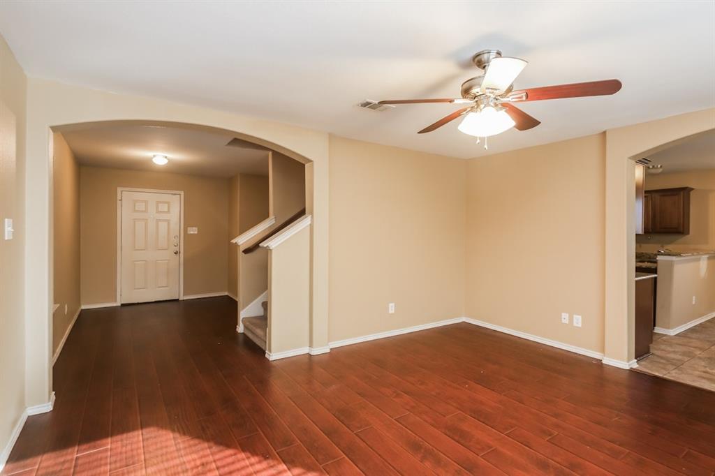 148 Cliff Height Circle Dallas, TX 75241 - Photo 9 of 17 a view of empty room with wooden floor and fan