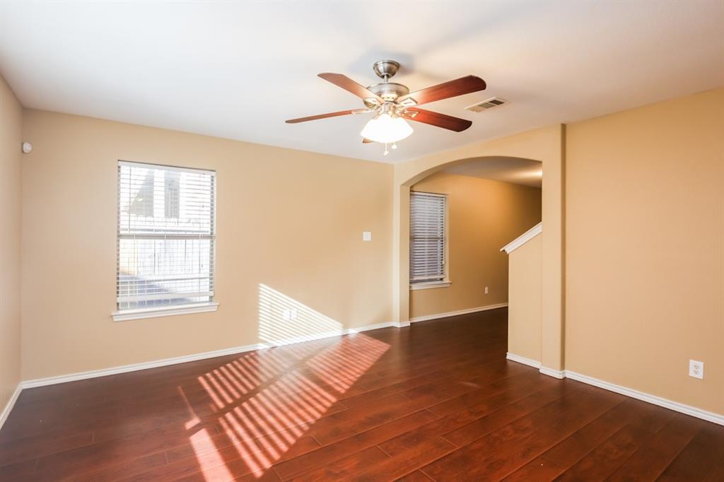148 Cliff Height Circle Dallas, TX 75241 - Photo 10 of 17 a view of an empty room with wooden floor and a window