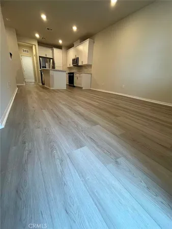 a view of a kitchen with a sink and a microwave