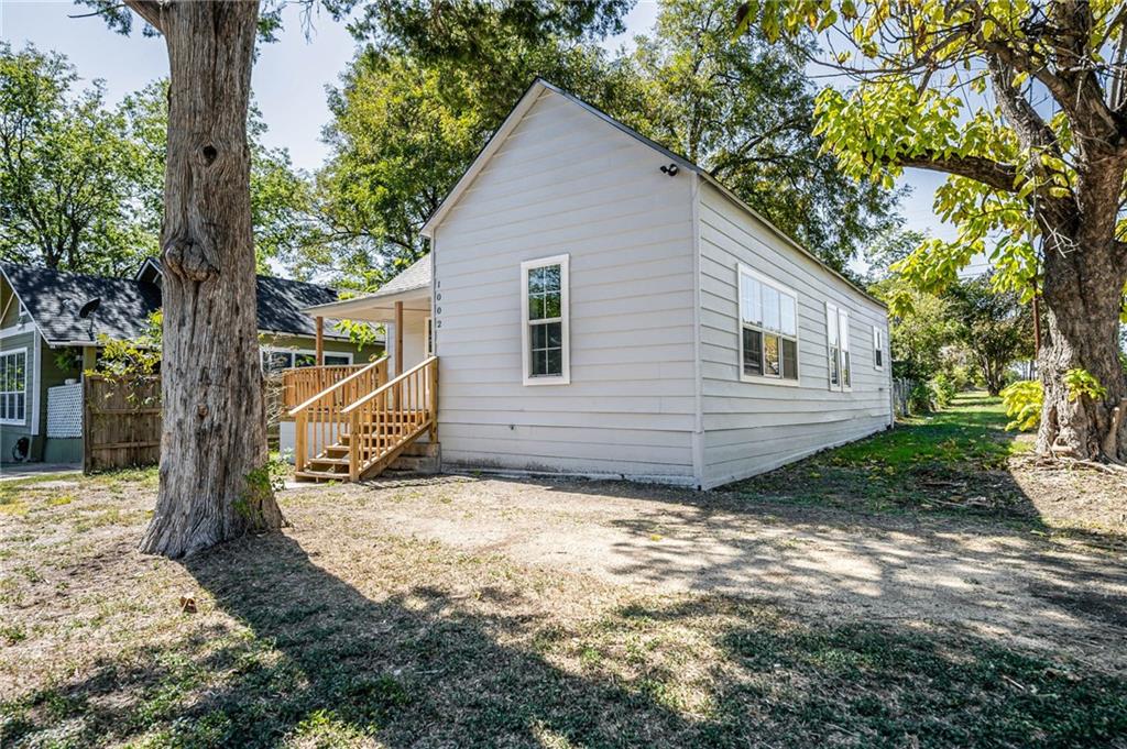 1002 South 2nd Street Temple, TX 76504 - Photo 2 of 10 a view of a house with a tree in the yard