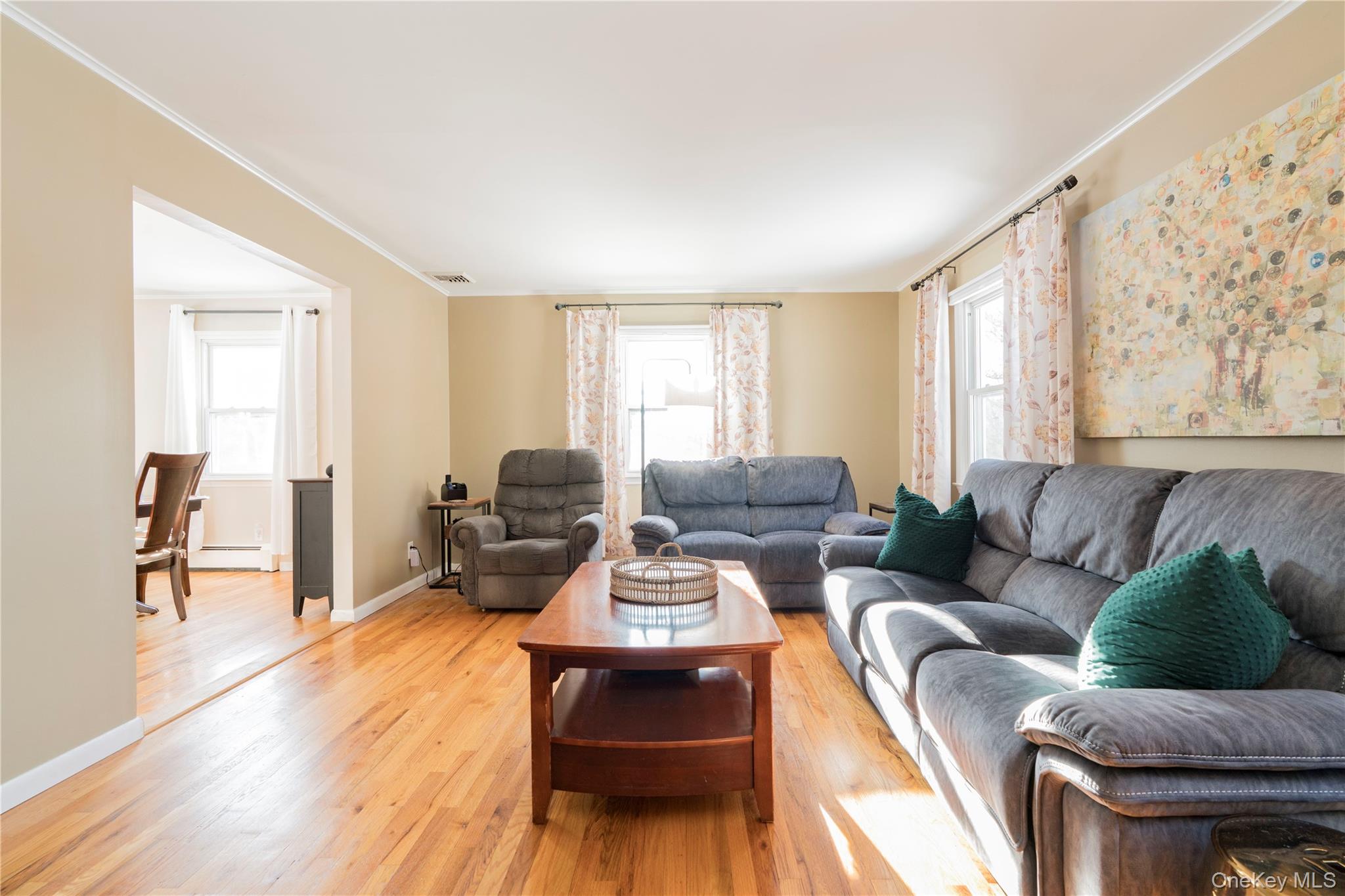 16 Saddle Ridge Drive Hopewell Junction, NY 12533 - Photo 8 of 19 Light, Bright Living area featuring light wood floors, crown molding,