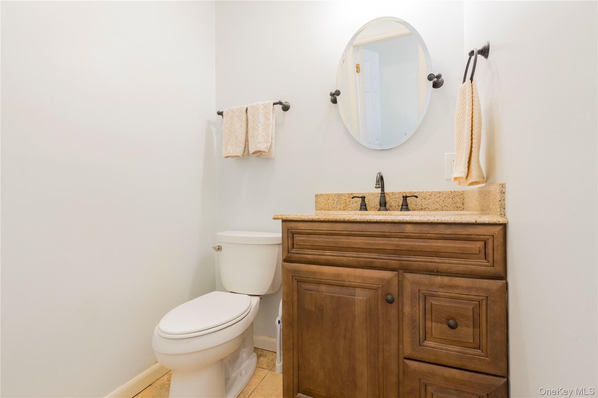 16 Saddle Ridge Drive Hopewell Junction, NY 12533 - Photo 9 of 19 Half bath with vanity and light tile patterned floors