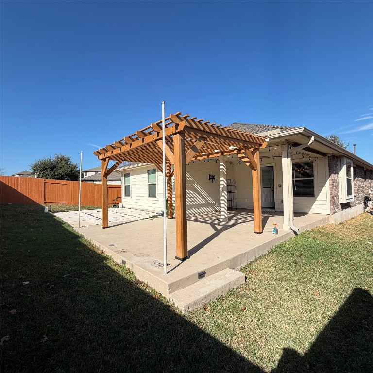 1115 Sunny Meadows Loop Georgetown, TX 78626 - Photo 32 of 36 Back of property with a pergola, a patio, and a fenced backyard
