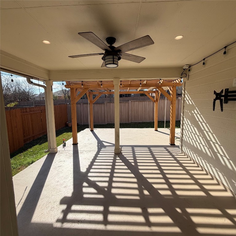 1115 Sunny Meadows Loop Georgetown, TX 78626 - Photo 33 of 36 Fenced backyard with a ceiling fan and a patio