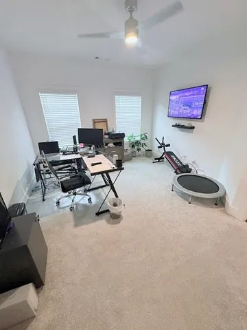 a view of a workspace with furniture