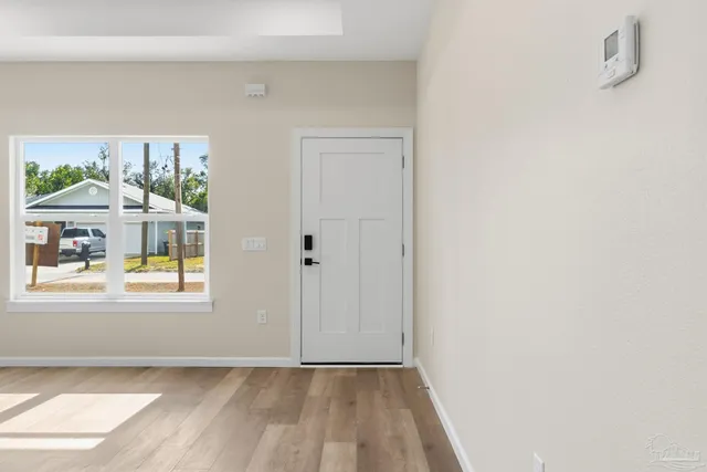 a view of an empty room and window