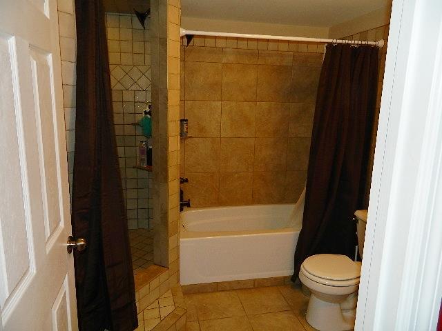 638 Pernell Road White Bluff, TN 37187 - Photo 12 of 17 Master bath has new tiled walk in shower and separate tub. Also has new tile floor.