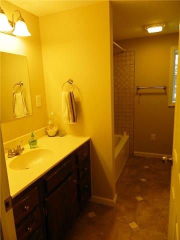 638 Pernell Road White Bluff, TN 37187 - Photo 16 of 17 Main bathroom has shower/tub combination and new tile floor.