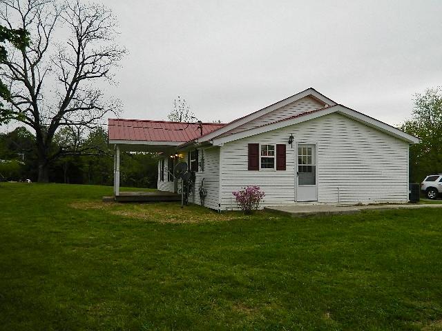 638 Pernell Road White Bluff, TN 37187 - Photo 3 of 17 Side view shows nice concrete walk.