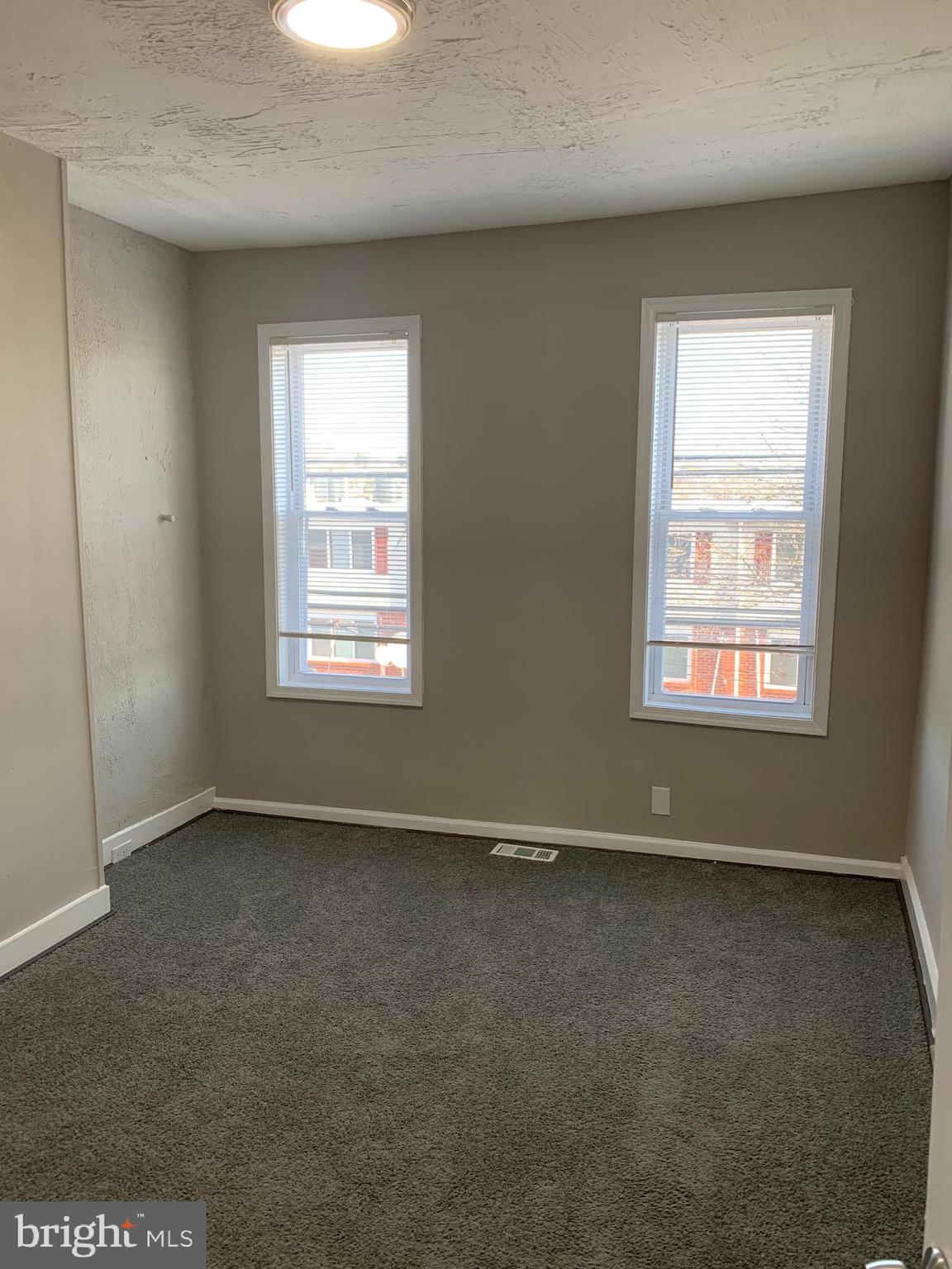 2708 Mathews Street Baltimore, MD 21218 - Photo 10 of 19 an empty room with a window