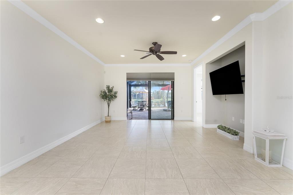 13869 Alafaya Street Venice, FL 34293 - Photo 19 of 75 a view of a livingroom with a flat screen tv and window