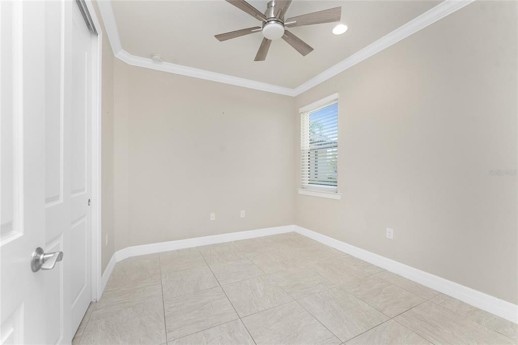 13869 Alafaya Street Venice, FL 34293 - Photo 32 of 75 a view of an empty room with a window