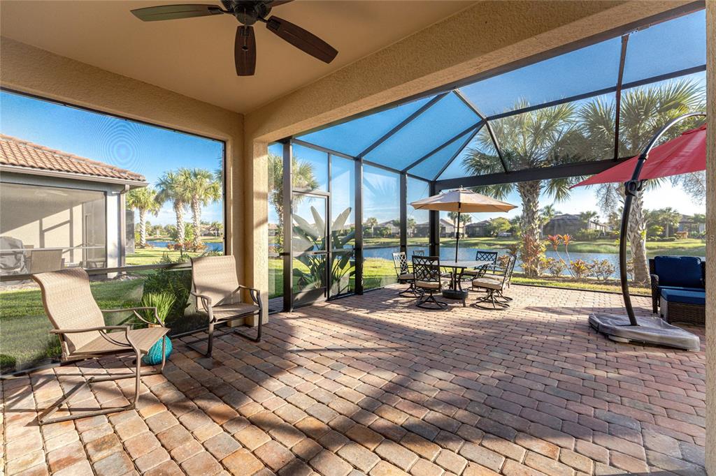 13869 Alafaya Street Venice, FL 34293 - Photo 37 of 75 a view of a work space with furniture and floor to ceiling window