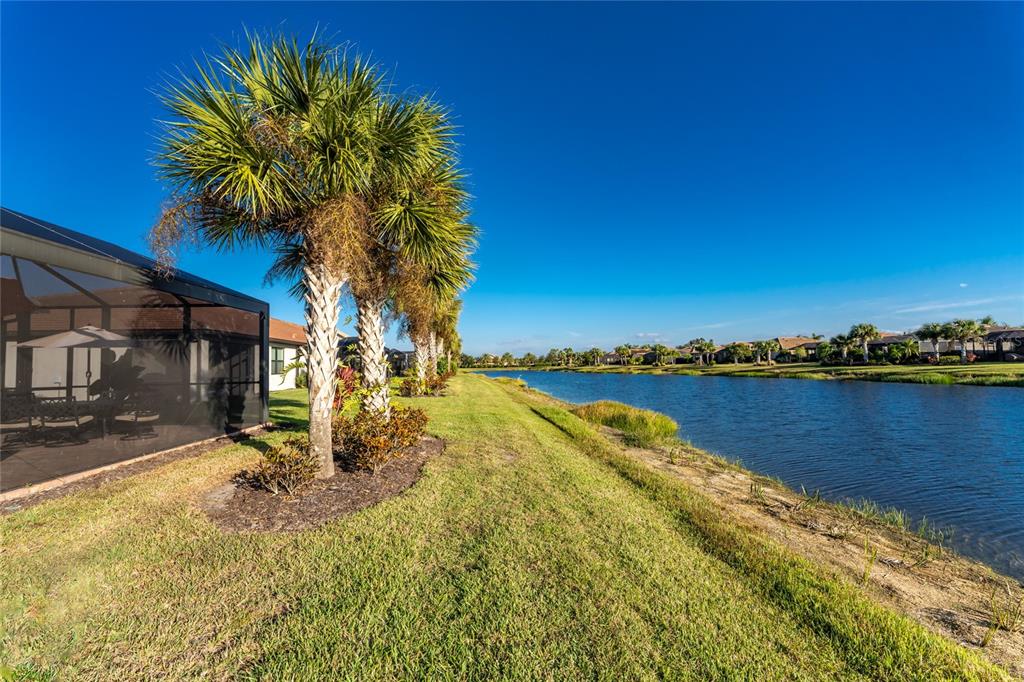 13869 Alafaya Street Venice, FL 34293 - Photo 41 of 75 a view of a lake with a house in the background
