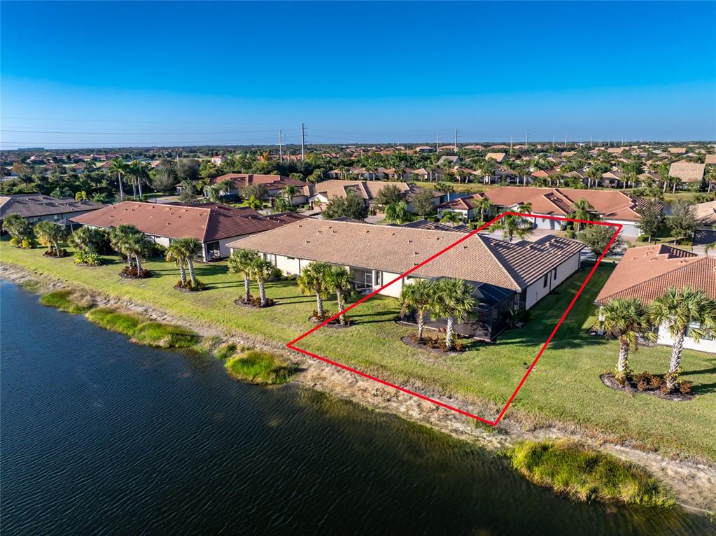 13869 Alafaya Street Venice, FL 34293 - Photo 42 of 75 an aerial view of a houses with a yard