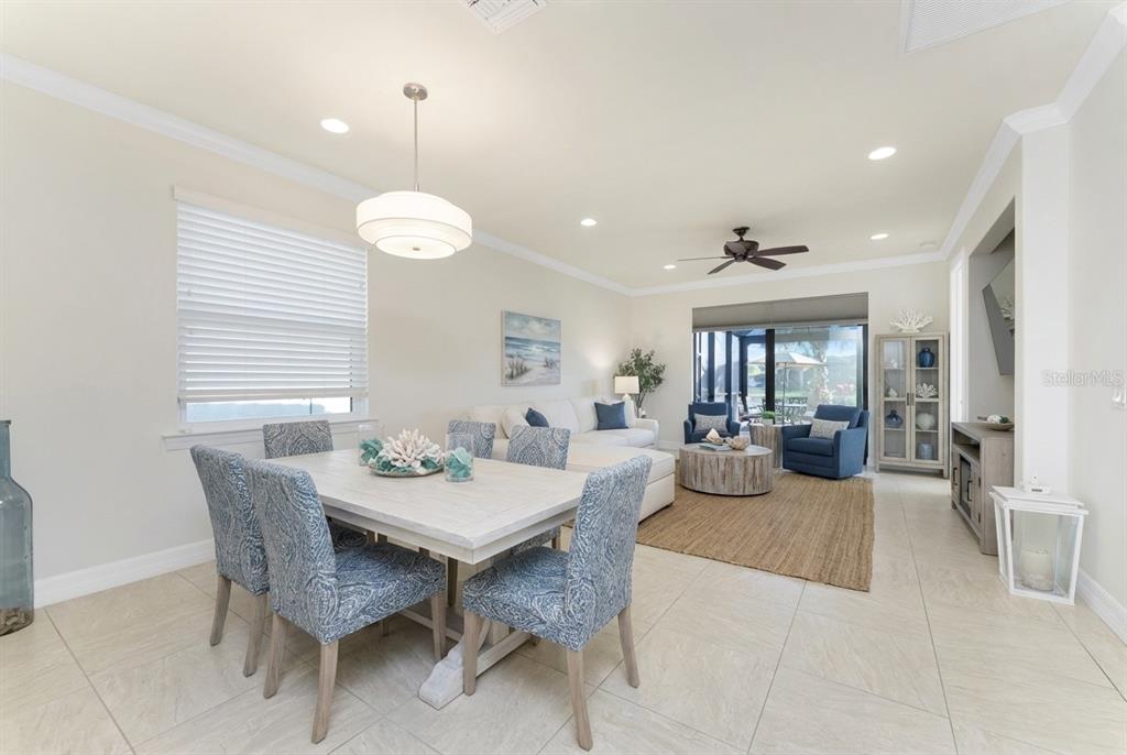13869 Alafaya Street Venice, FL 34293 - Photo 8 of 75 a view of a dining room with furniture and chandelier