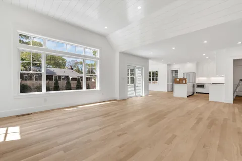 a view of kitchen and wooden floor