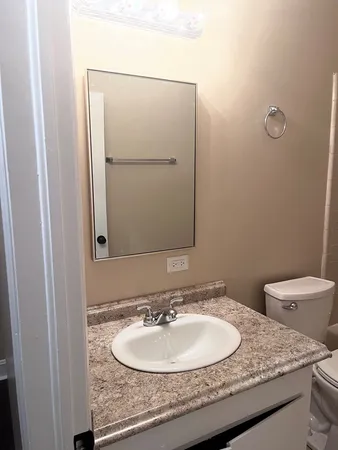 a bathroom with a toilet and a bathtub