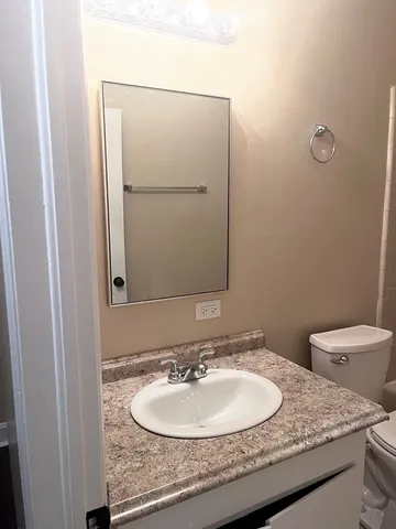 a bathroom with a toilet and a bathtub