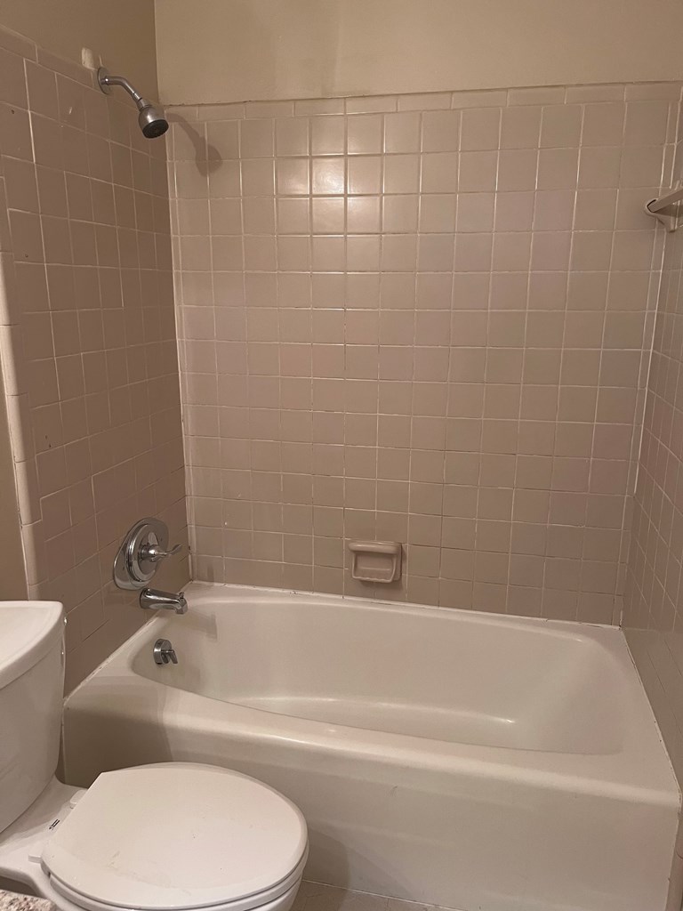 2312 15th Street, Unit C Columbus, GA 31906 - Photo 25 of 26 a bathroom with a toilet and a bathtub