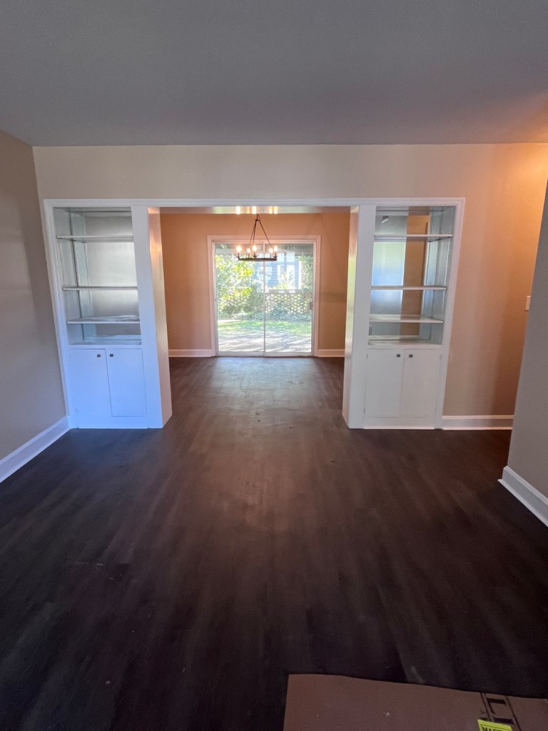 2312 15th Street, Unit C Columbus, GA 31906 - Photo 8 of 26 a view of empty room with wooden floor and fan