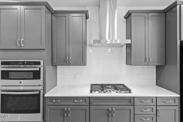 a kitchen with cabinets and appliances