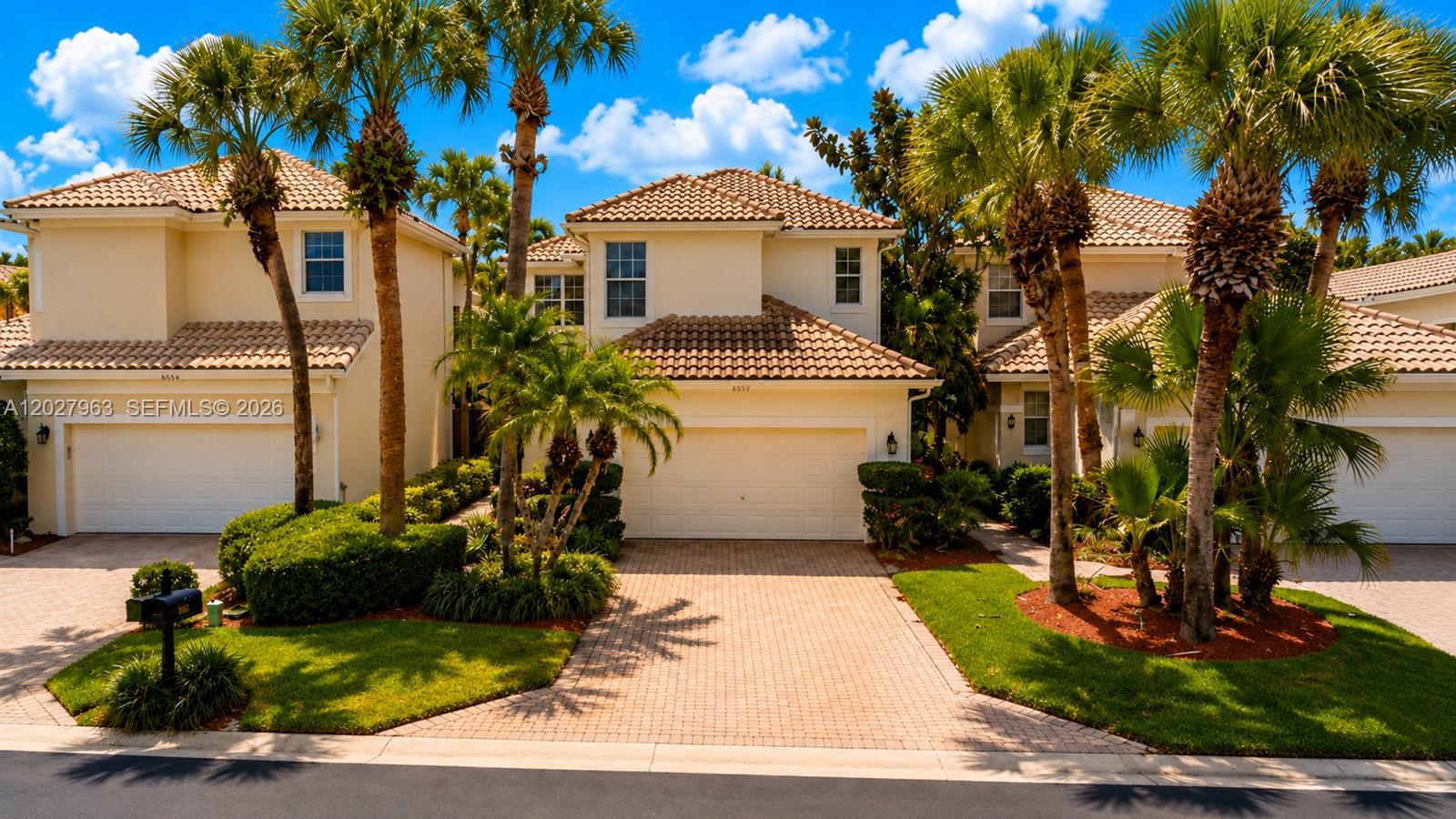 6646 Northwest 25th Terrace Boca Raton, FL 33496 - Photo 1 of 48 a front view of a house with a yard