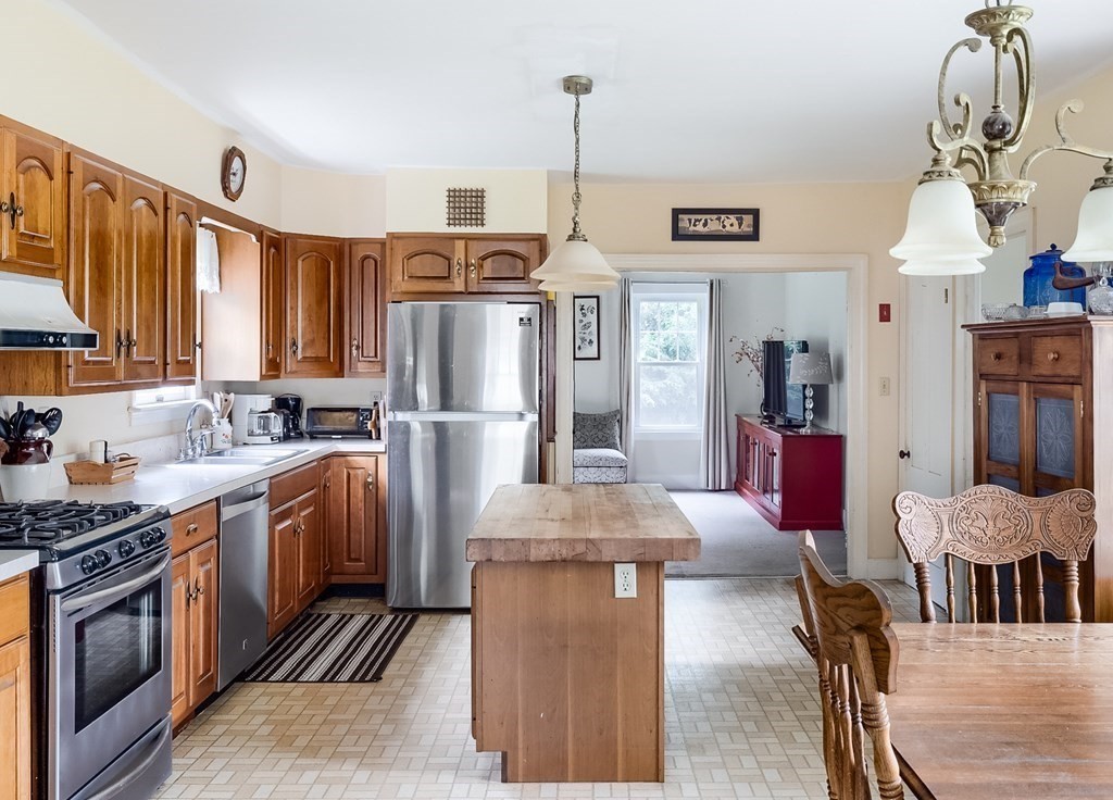 5 Leominster Road Princeton, MA 01541 - Photo 8 of 41 a kitchen with stainless steel appliances granite countertop a stove refrigerator and a view of living room