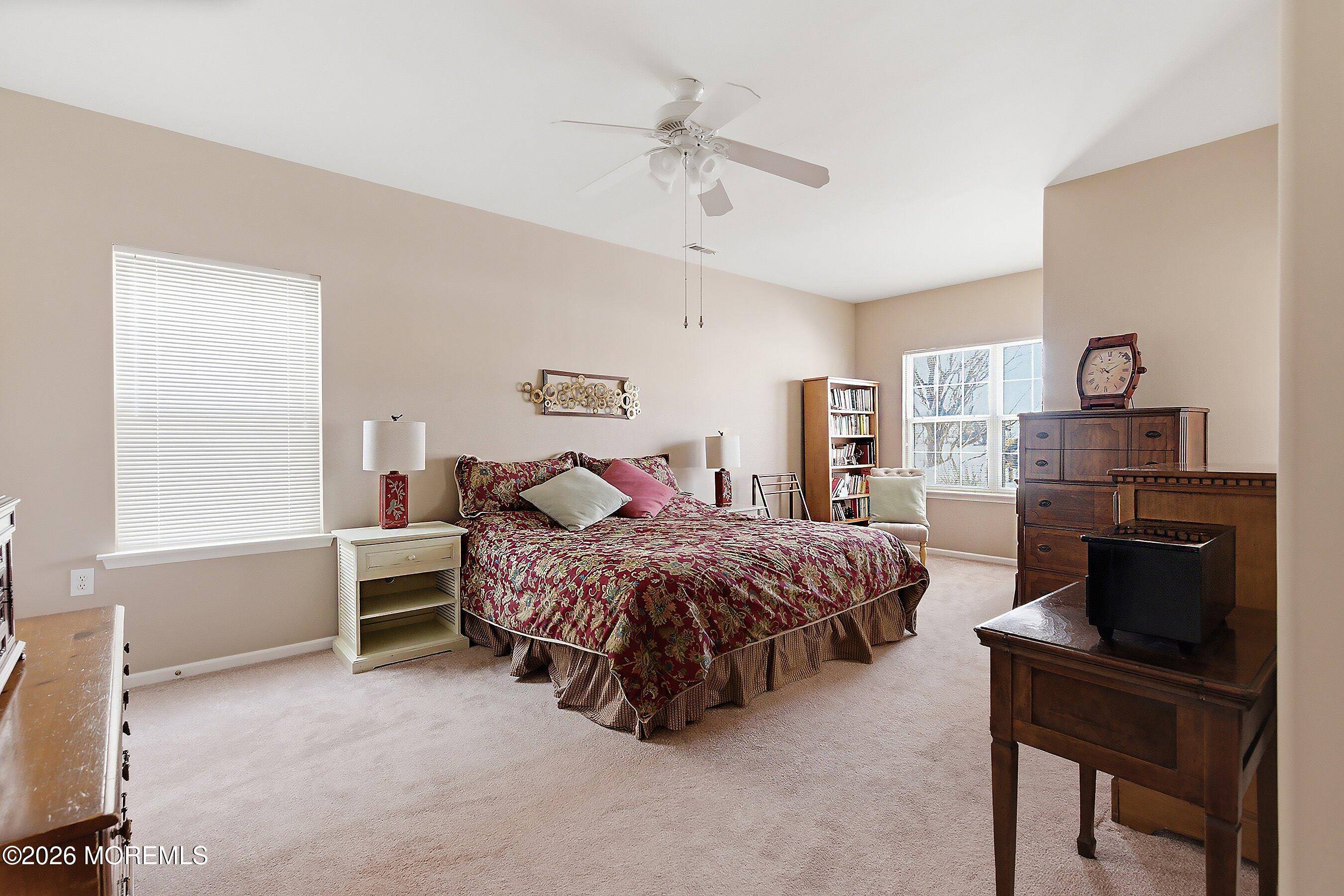 10 Arcadia Drive Manchester Township, NJ 08759 - Photo 11 of 37 a bed room with a bed and a chair