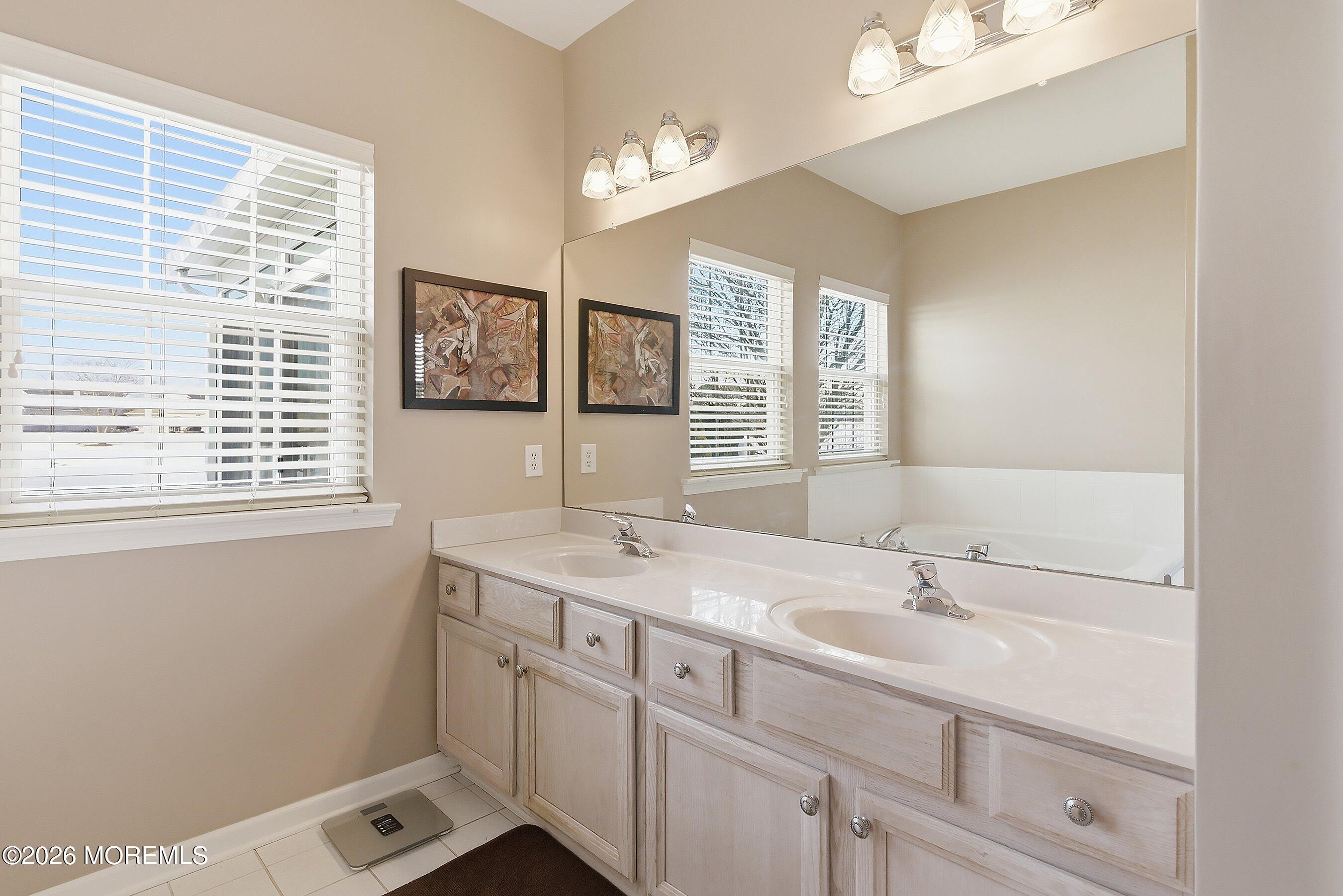 10 Arcadia Drive Manchester Township, NJ 08759 - Photo 12 of 37 a bathroom with a sink and a window