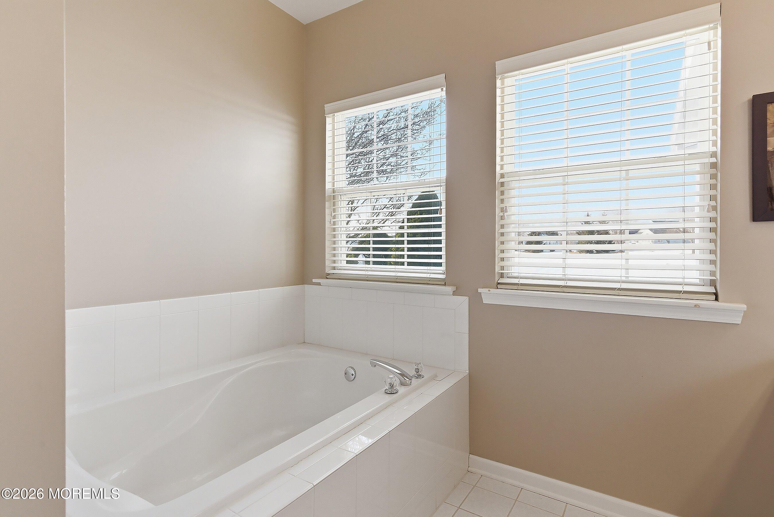 10 Arcadia Drive Manchester Township, NJ 08759 - Photo 13 of 37 a bathroom with bathtub and window