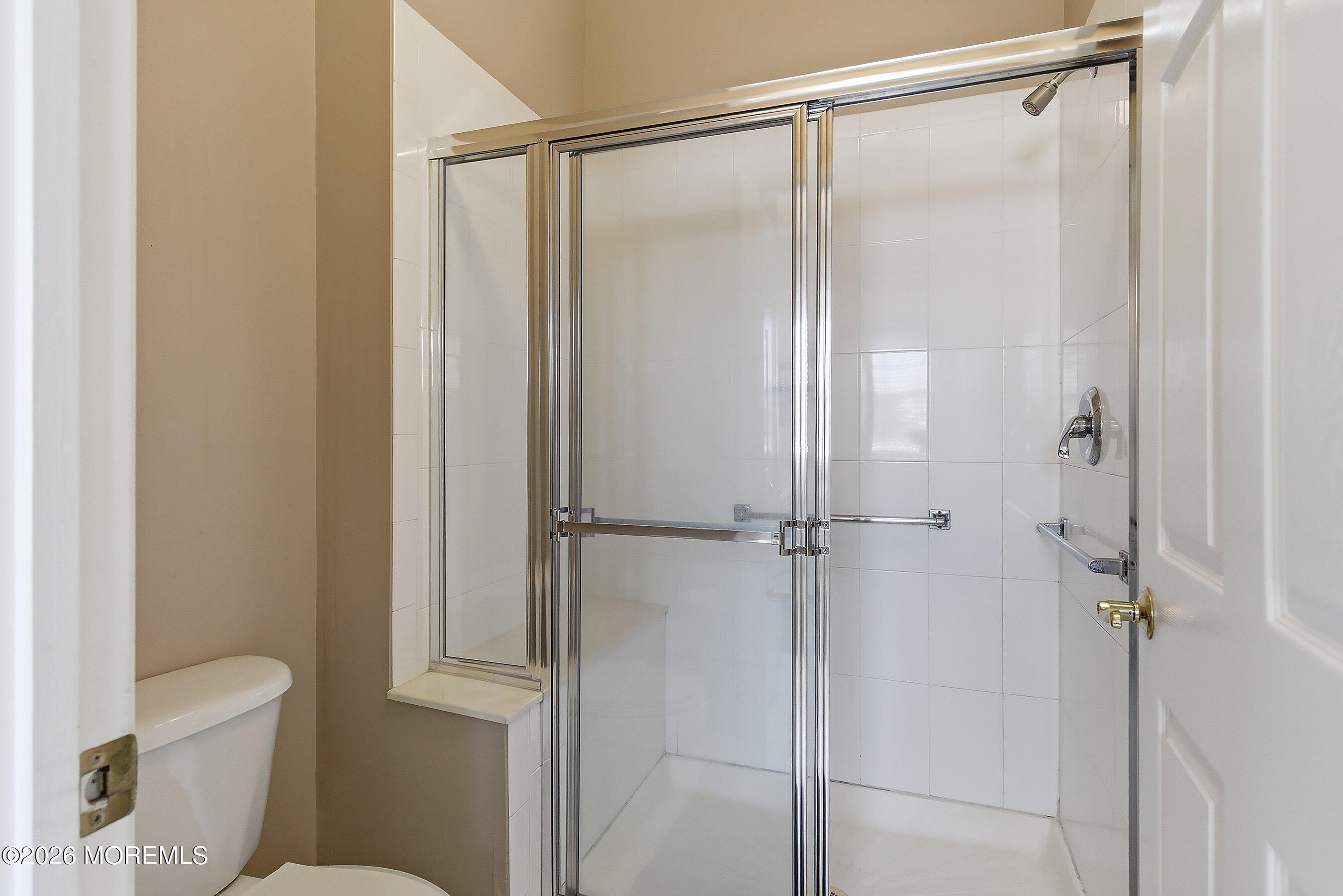 10 Arcadia Drive Manchester Township, NJ 08759 - Photo 14 of 37 a bathroom with a shower and a toilet