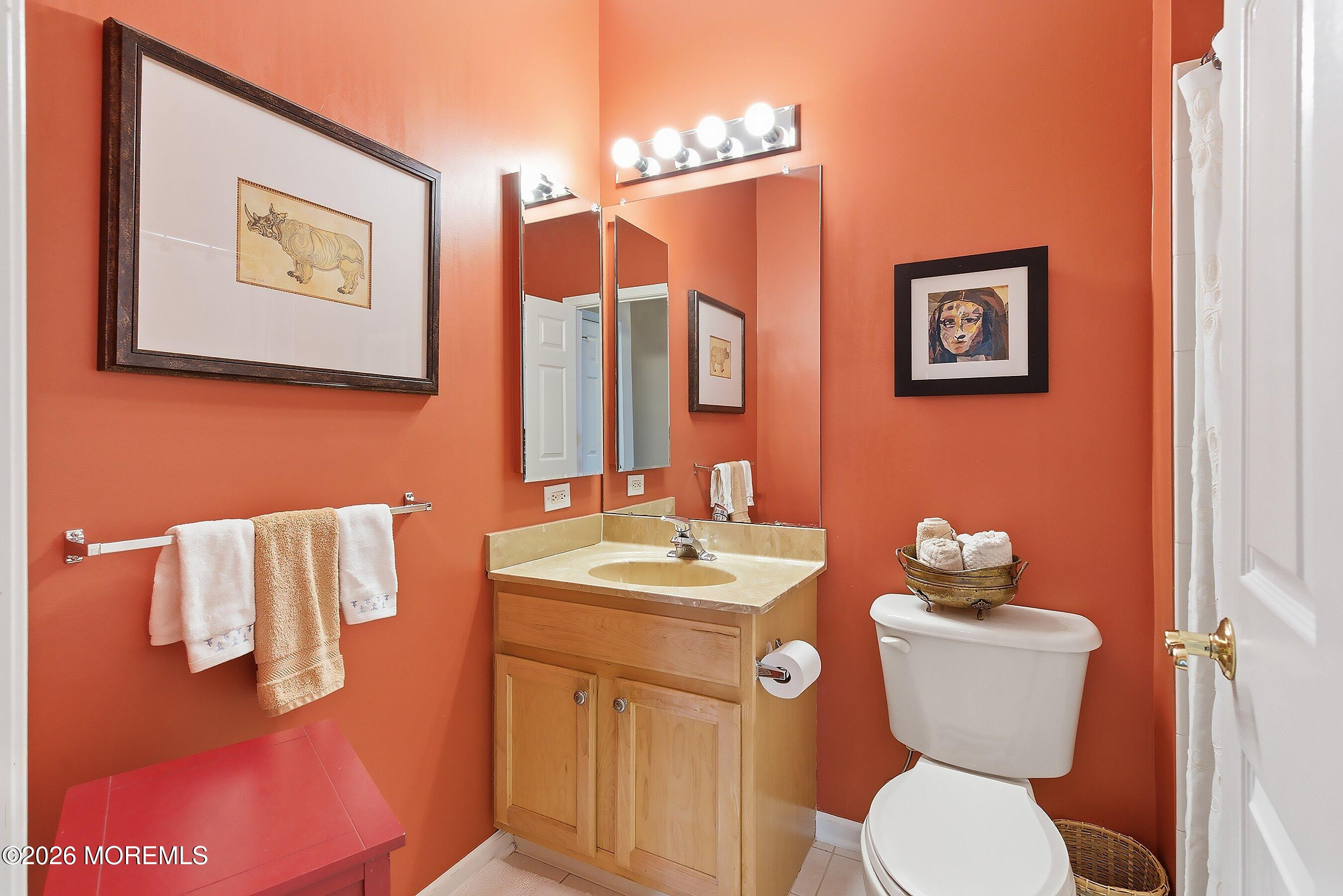 10 Arcadia Drive Manchester Township, NJ 08759 - Photo 16 of 37 a bathroom with a toilet sink and mirror