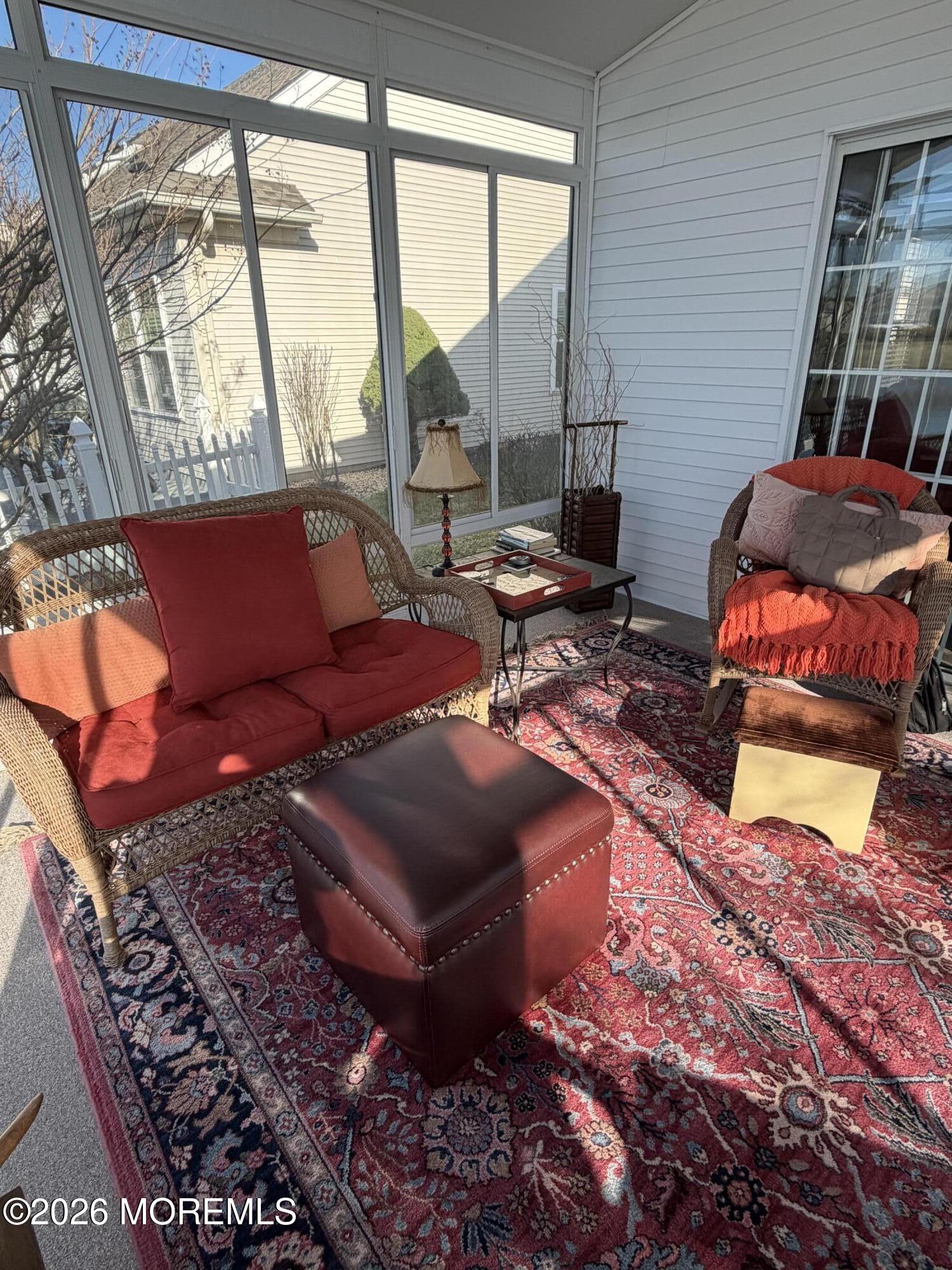 10 Arcadia Drive Manchester Township, NJ 08759 - Photo 18 of 37 a living room with furniture and a floor to ceiling window