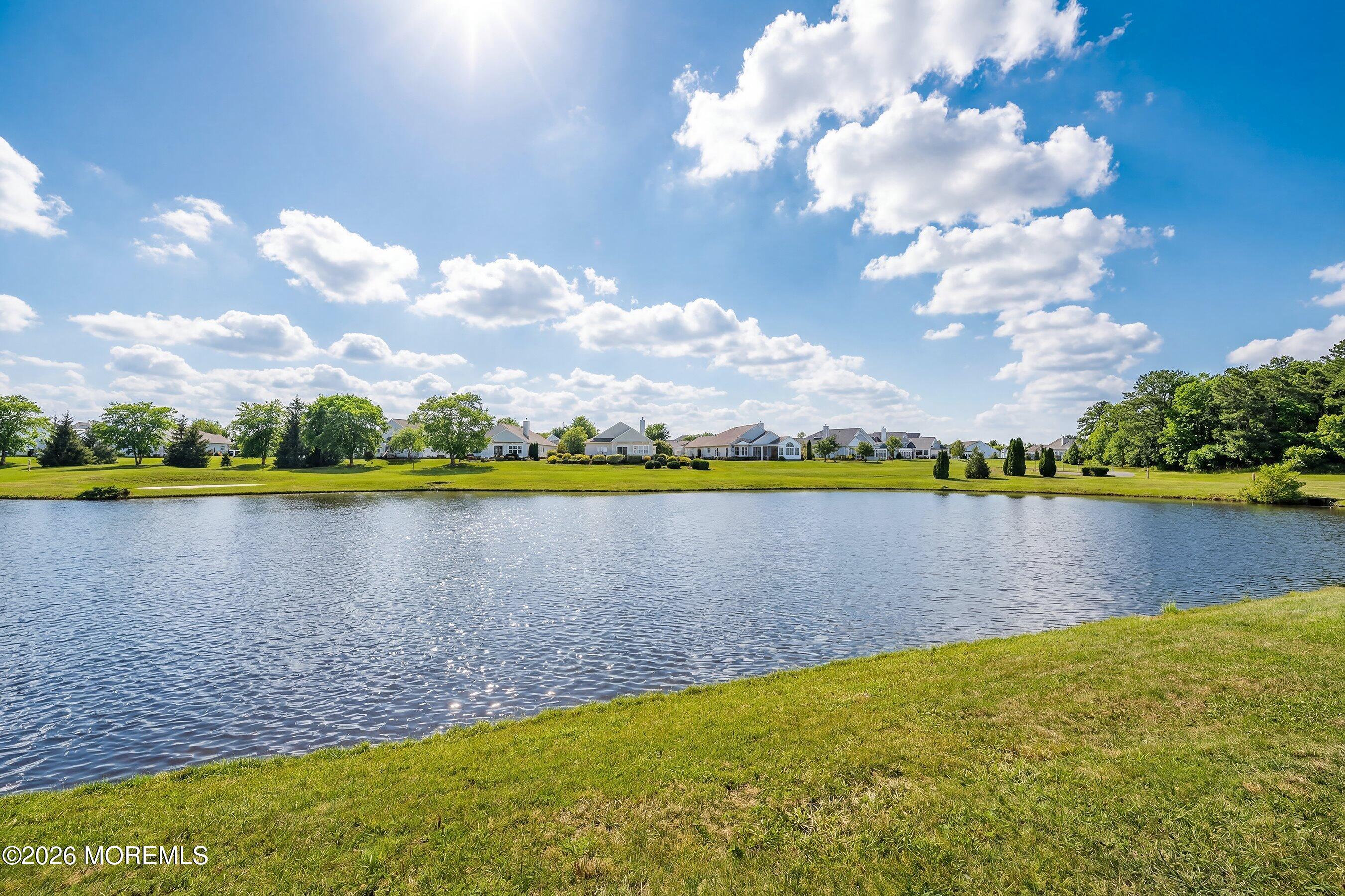 10 Arcadia Drive Manchester Township, NJ 08759 - Photo 21 of 37 a view of a lake with houses in the background