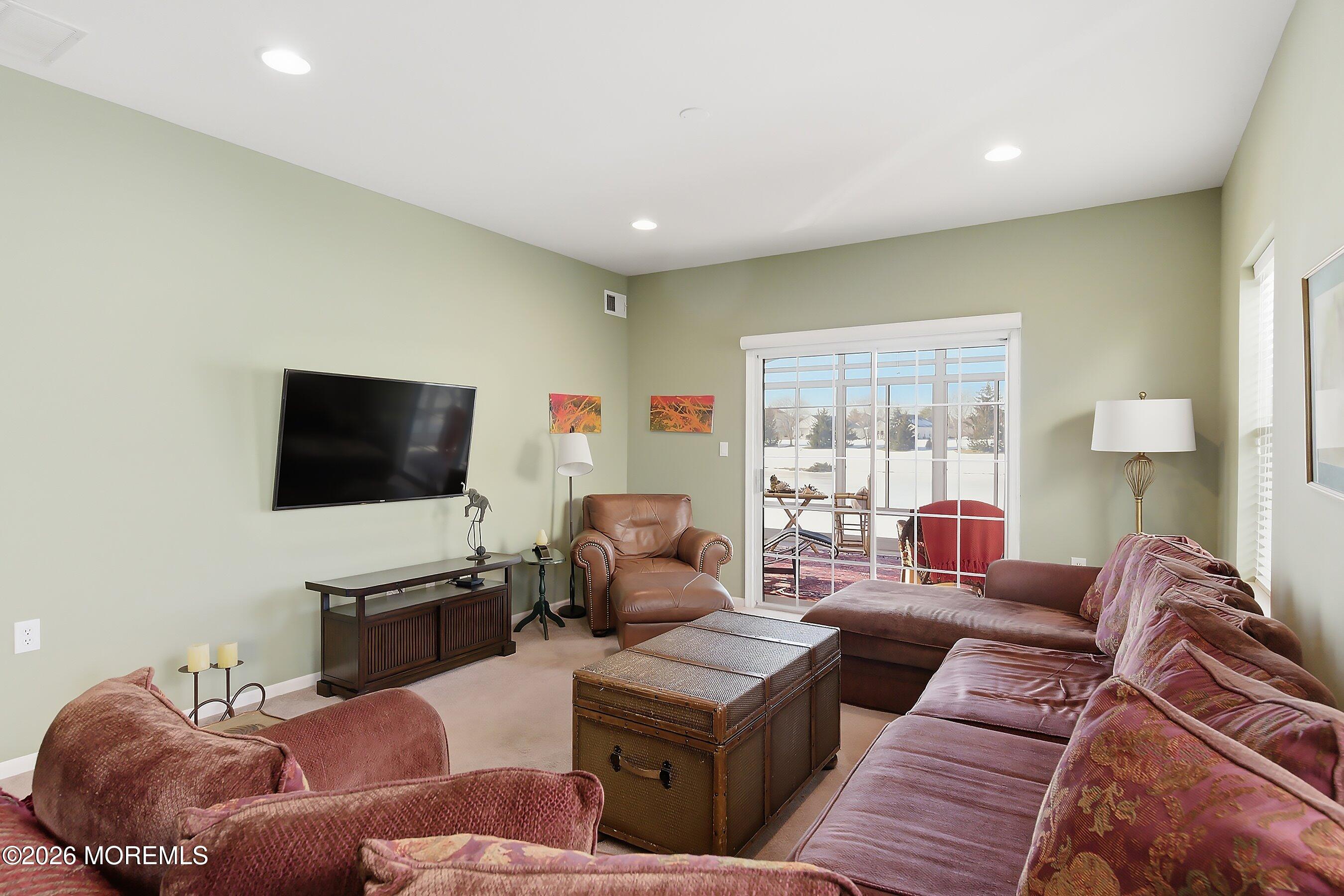 10 Arcadia Drive Manchester Township, NJ 08759 - Photo 9 of 37 a living room with furniture and a flat screen tv