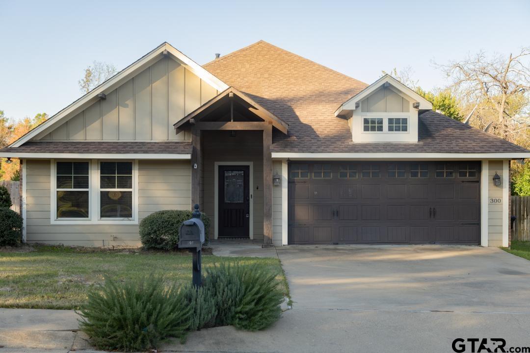 300 Rita Drive Lindale, TX 75771 - Photo 1 of 17 a front view of a house with a garden