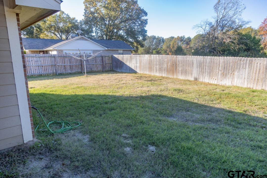 300 Rita Drive Lindale, TX 75771 - Photo 15 of 17 a view of a swimming pool with a patio and a yard with swimming pool