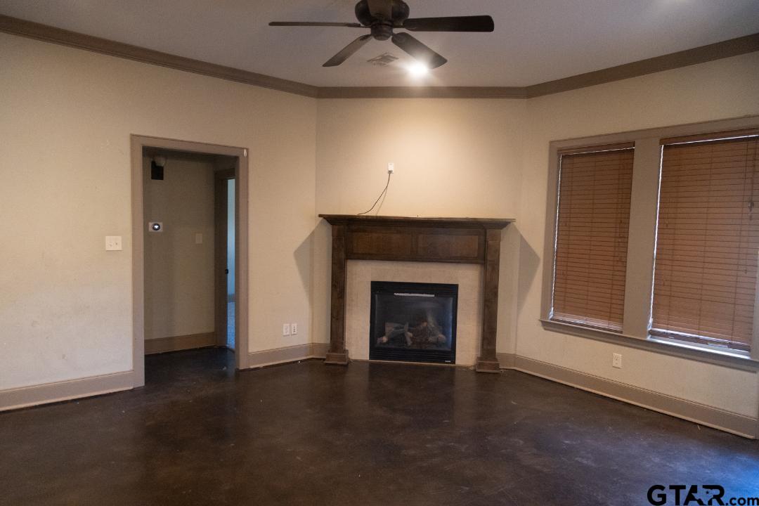 300 Rita Drive Lindale, TX 75771 - Photo 2 of 17 an empty room with windows and fireplace