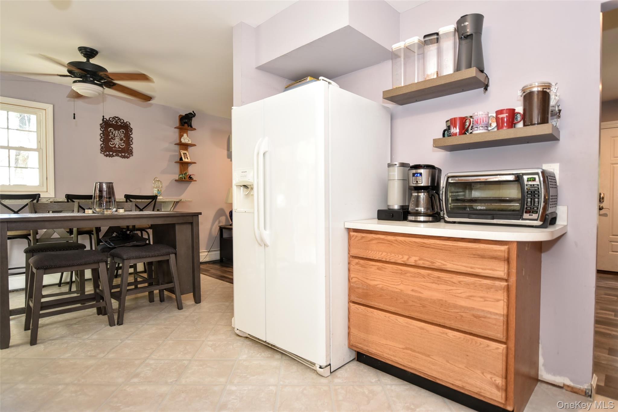 121 Hammond Road Thiells, NY 10984 - Photo 11 of 27 a kitchen with a refrigerator and a table