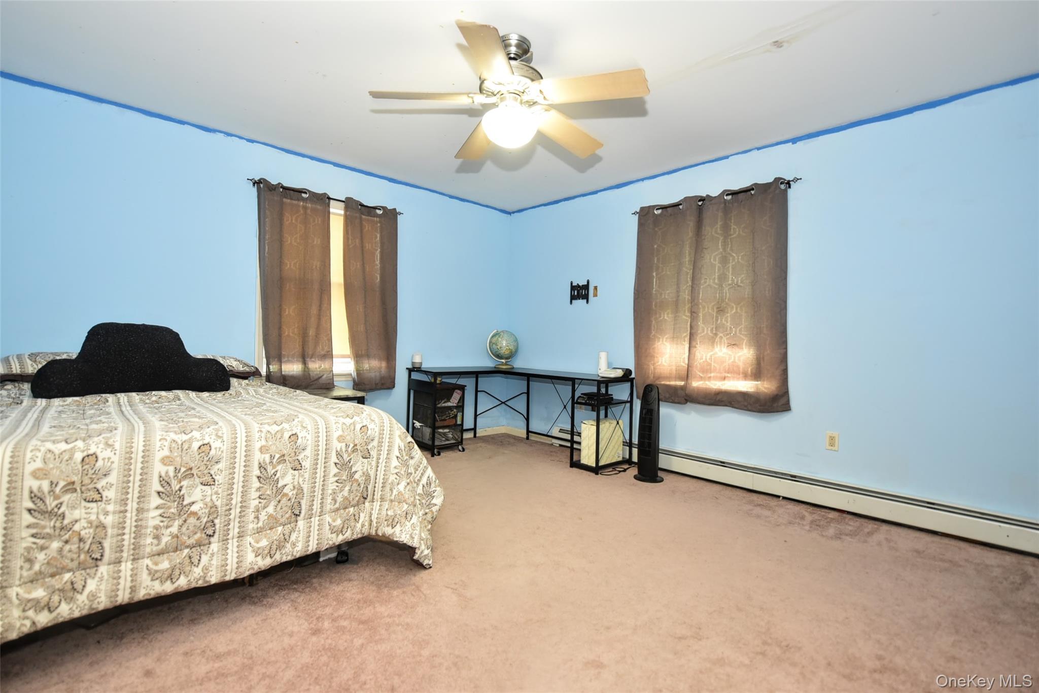 121 Hammond Road Thiells, NY 10984 - Photo 14 of 27 a bedroom with a bed and a chandelier