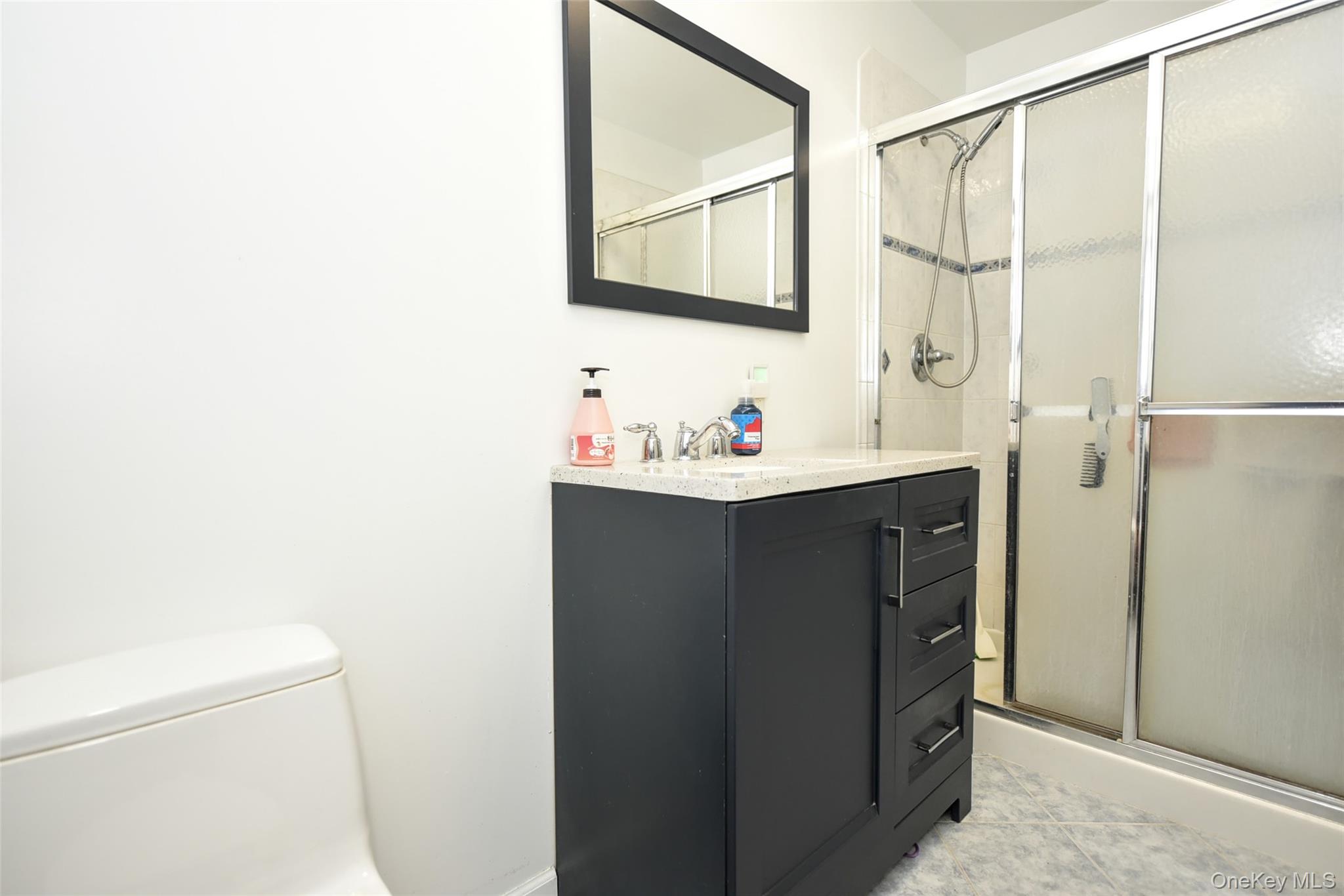 121 Hammond Road Thiells, NY 10984 - Photo 16 of 27 a bathroom with a sink and a mirror