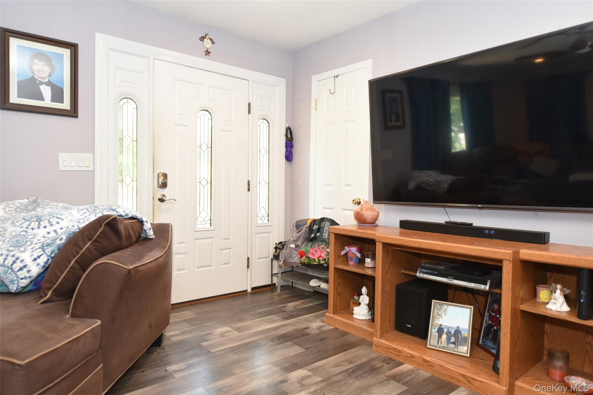 121 Hammond Road Thiells, NY 10984 - Photo 3 of 27 a living room with furniture and a flat screen tv