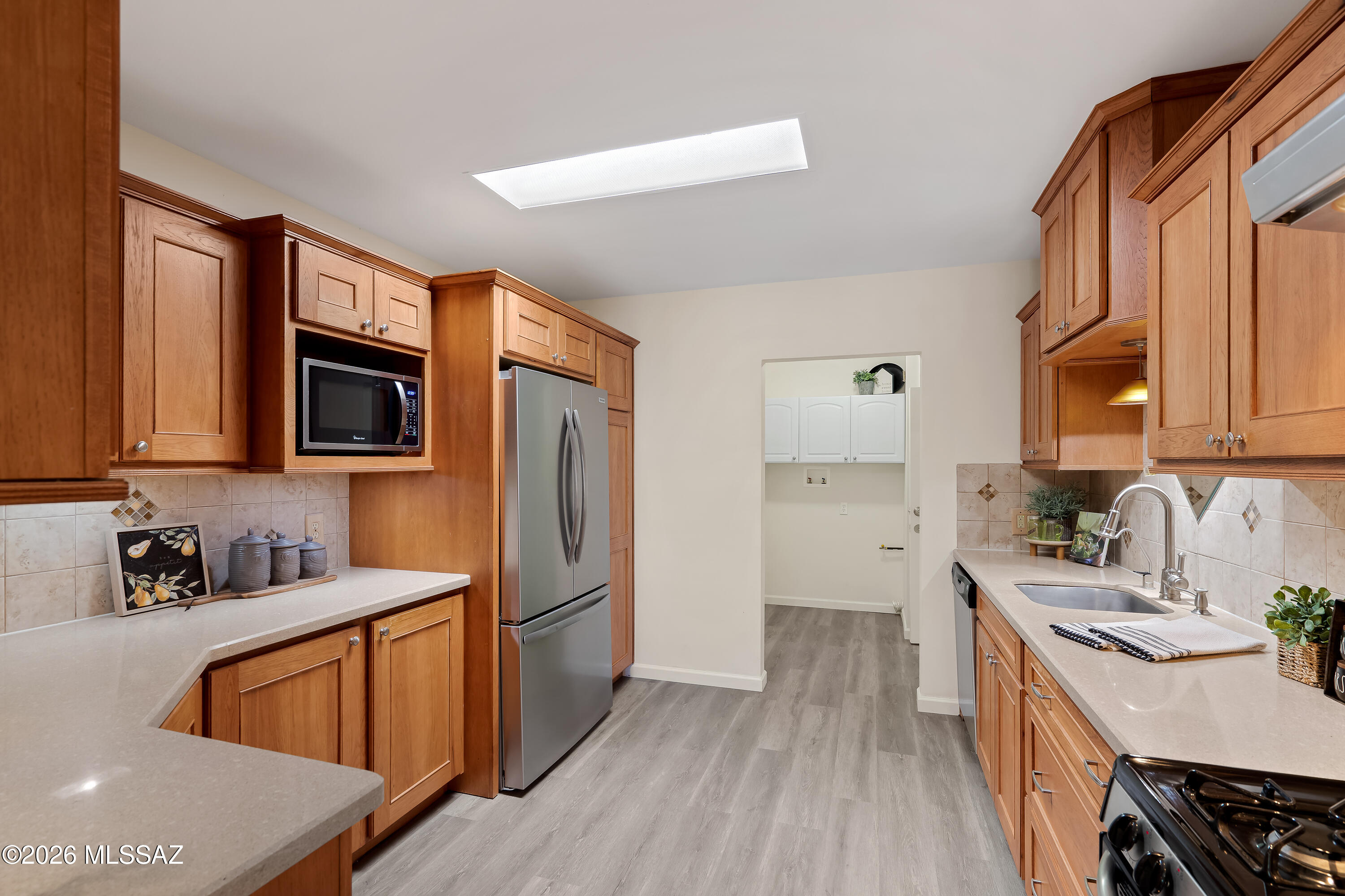 3150 East Presidio Road Tucson, AZ 85716 - Photo 19 of 33 Convenient kitchen access to laundry room and large pantry.