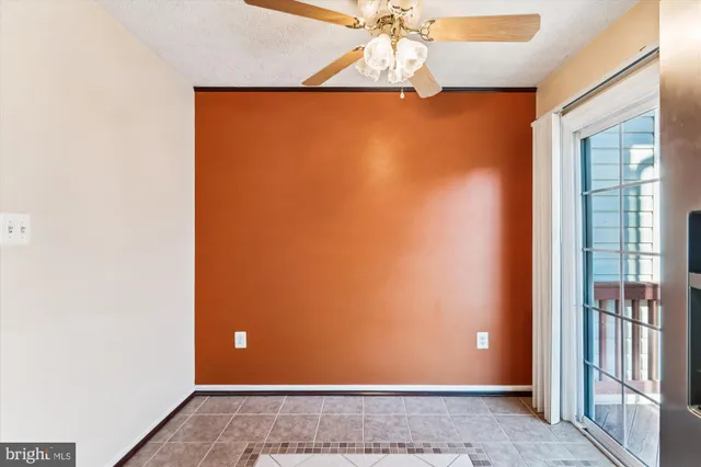 a kitchen with stainless steel appliances granite countertop a refrigerator sink and stove