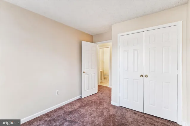 a view of a hallway with staircase
