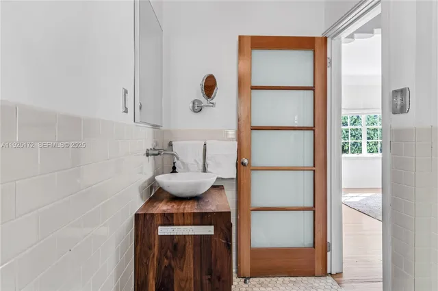 a bathroom with a sink and a mirror
