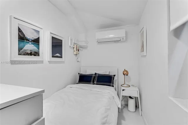 a bedroom with a bed and cabinets