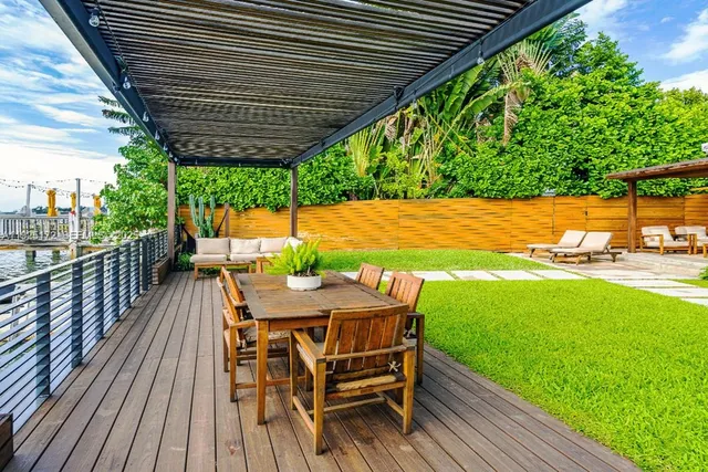 a view of a wooden deck with furniture